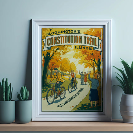 Framed poster for Bloomington's Constitution Trail, Illinois, with cyclists and autumn trees.