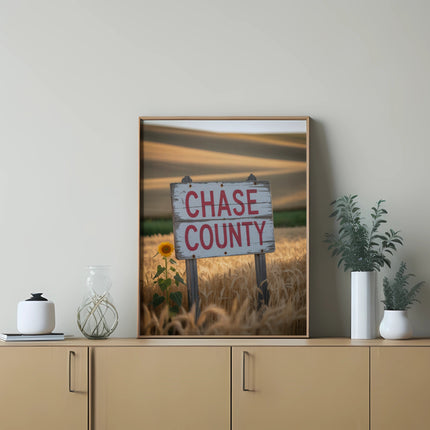 Wooden sign in a wheat field reads "CHASE COUNTY".
