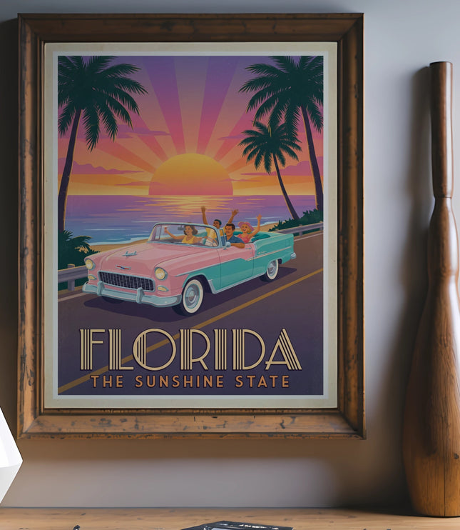Framed poster featuring a vintage convertible driving toward a Florida sunset with palm trees.
