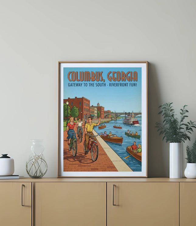 Columbus, Georgia poster showing riverfront with people biking and boats.