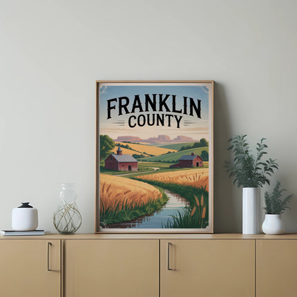 Framed artwork depicting a rural Franklin County landscape with a barn and wheat fields.