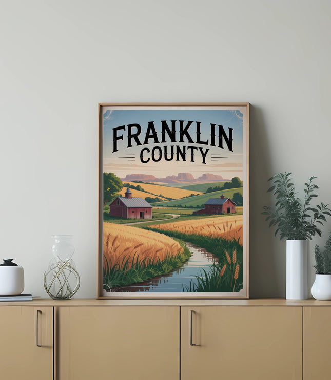 Framed artwork depicting a rural Franklin County landscape with a barn and wheat fields.