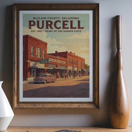 Framed poster depicting Purcell, Oklahoma main street with vintage car and text.