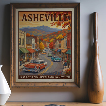 Framed vintage poster depicting Asheville, North Carolina street with classic cars and autumn trees.