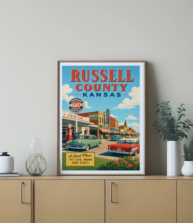 Retro poster for Russell County, Kansas, featuring vintage gas station and buildings.
