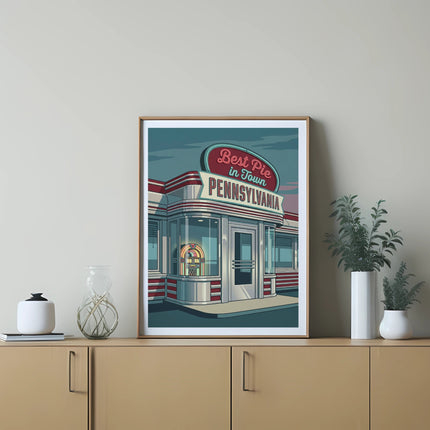 Diner with "Best Pie In Town Pennsylvania" neon sign in framed artwork.