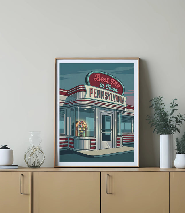 Diner with "Best Pie In Town Pennsylvania" neon sign in framed artwork.