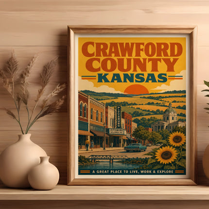 Framed vintage-style poster of Crawford County, Kansas, with text and a town scene.