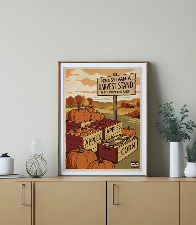 Framed vintage "Pennsylvania Harvest Stand" poster featuring pumpkins and apples.