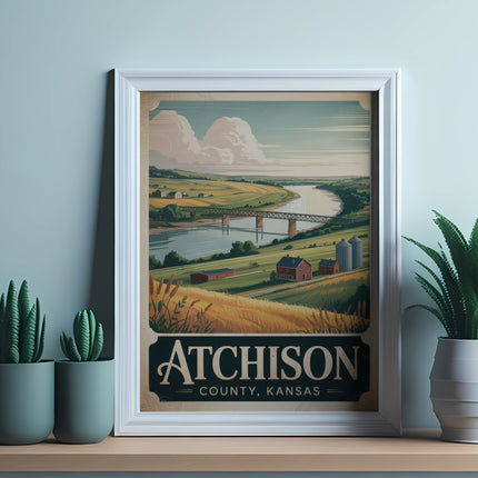 Framed vintage travel poster for Atchison, Kansas showing a rural landscape and bridge.