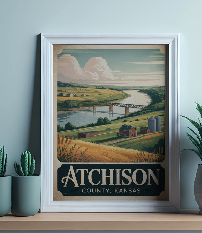 Framed vintage travel poster for Atchison, Kansas showing a rural landscape and bridge.