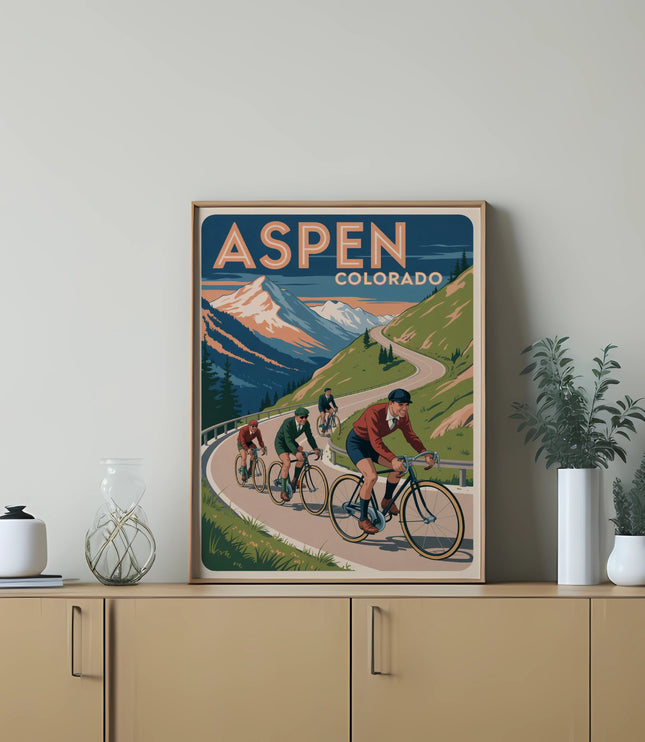 Vintage poster for Aspen, Colorado, featuring cyclists on a mountain road.