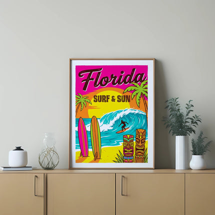 Florida surf and sun vintage travel poster with surfers and tiki statues.