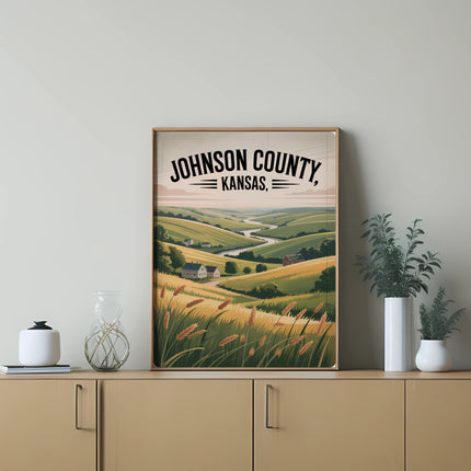 Framed artwork depicting rolling hills of golden wheat fields and a distant farmhouse in Johnson County, Kansas.
