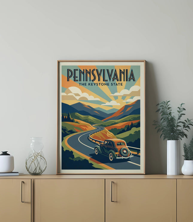 Vintage car on a winding road with "Pennsylvania The Keystone State" text.